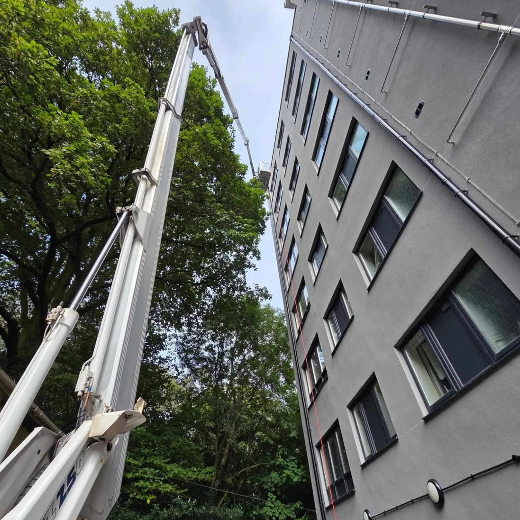 window-cleaning lift beside building